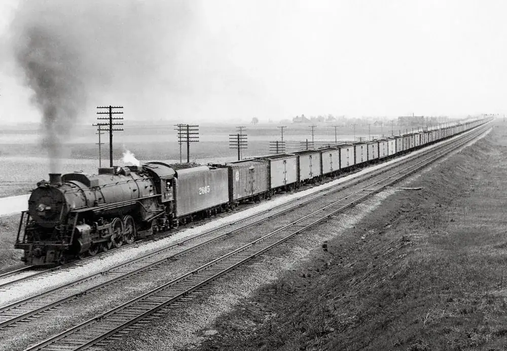 Long string of refrigerator cars north on the main line